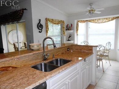 Kitchen with granite countertop, raised kitchen ca