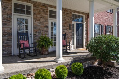 Imagine enjoying a cup of coffee on this rocking chair front porch...