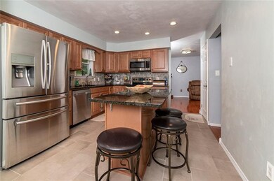 FEATURING CUSTOM HICKORY CABINETRY, TILE FLOOR, GR