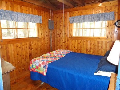 Bedroom with wood floor.