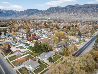 Aerial overview of property's location with nearby suburban area and a mountain backdrop