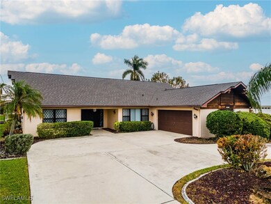 Single story home featuring a garage