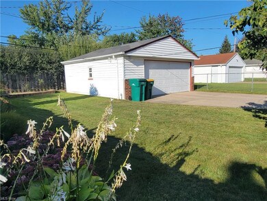Garage featuring garage and a lawn