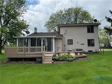 Large deck surrounds the beauty of this home