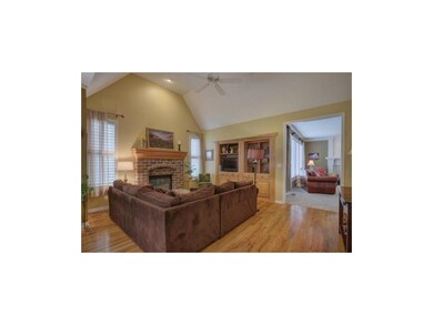 Adjacent to the great room is the hearth room. A b