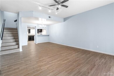 Open living and kitchen area with kitchen bar