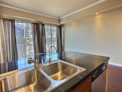 Kitchen featuring stainless steel dishwasher, crow