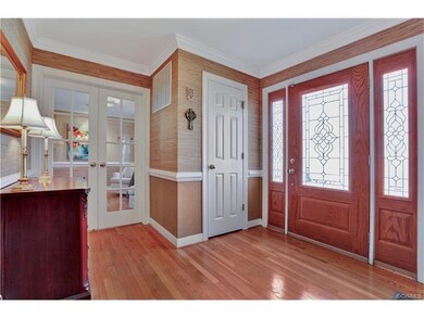 Gracious Entry Foyer with beautiful moldings and w