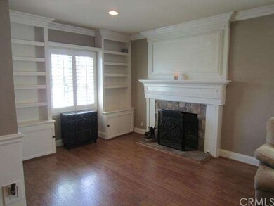 Living room with fireplace and built-in shelving  