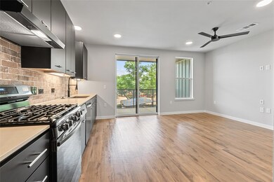 Kitchen with stainless steel appliances, exhaust 