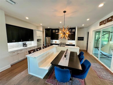 Kitchen with freestanding refrigerator, backsplas