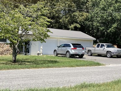 An office with separate entrance is located between the garage and the main house.