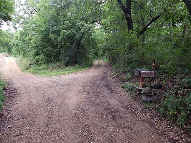 Driveway to the right leads to the property