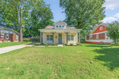 Bungalow-style house featuring a porch, a front ya