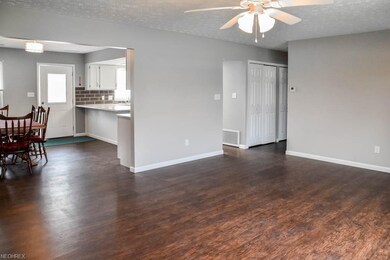 Spacious living room with laminate flooring.