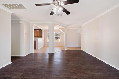 Unfurnished living room featuring wood finished f