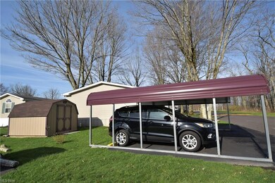 Carport and shed included.