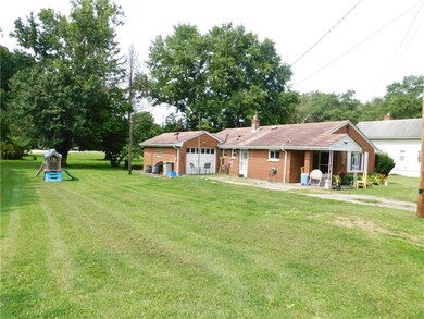 Level yard, one car attached garage.