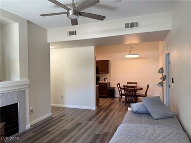 Living area featuring dark wood finished floors, c