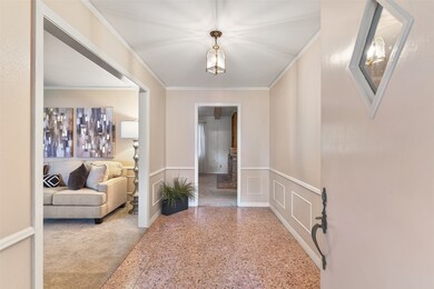 A picturesque covered front porch makes way to an