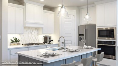 Kitchen with appliances with stainless steel fini