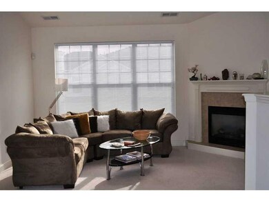 Exterior Front. Living Room with Gas Fireplace