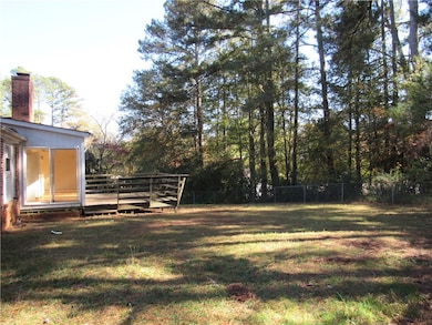 large fenced area with 2 gates