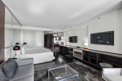 Living area featuring dark wood-style flooring and