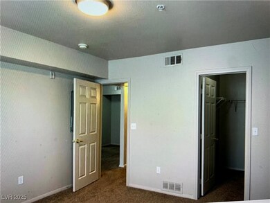 Unfurnished bedroom with a spacious closet, visibl