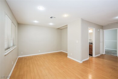 Unfurnished bedroom featuring visible vents, baseb