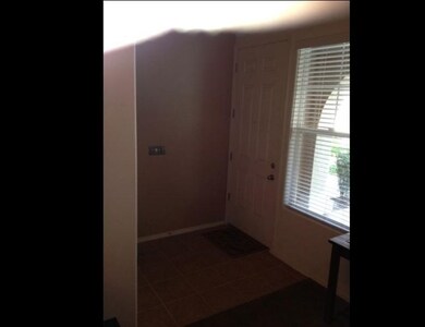 Another view of the entry way with dividing wall b