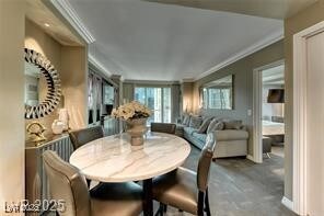 Dining space with crown molding