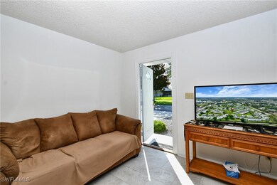 Living area featuring a textured ceiling
