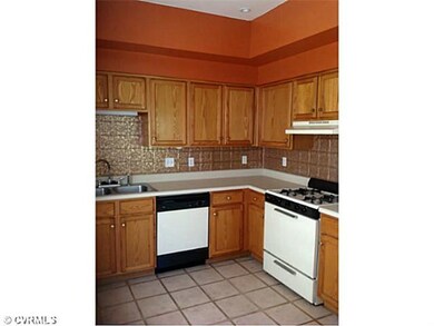 Kitchen - Gas cooking.  Kitchen opens to rear yard