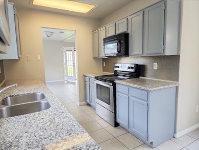 Kitchen- nicely updated with SS appliances, granit