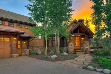 View of front of home with stone siding, board and