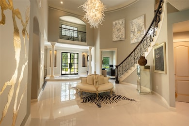 This is a spacious, elegant entryway featuring hig