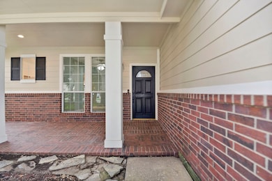 The brick porch with plenty of room for a table an