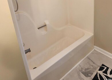 Full bath with baseboards and bathtub / shower combination