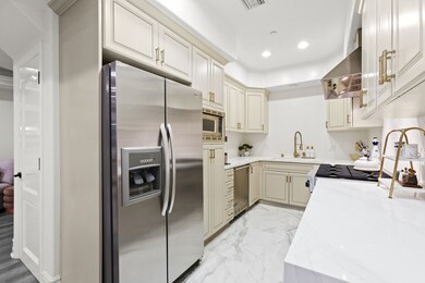 Ample quartz counter space + porcelain flooring.