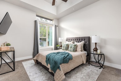 Carpeted bedroom featuring baseboards and ceiling