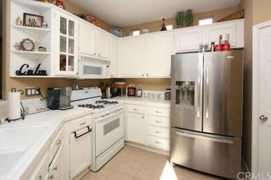 Open Kitchen has freshly painted cabinetry with ne