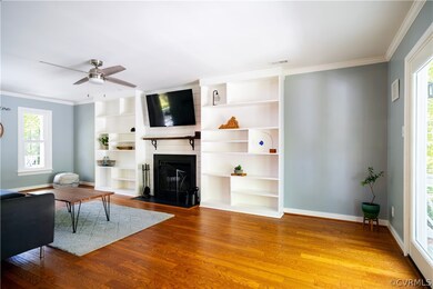 Living room with plenty of natural light, wood flo