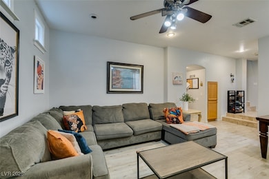 Living room featuring light wood-type flooring, ar