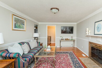 Family Room with Hardwood Floors and Fireplace