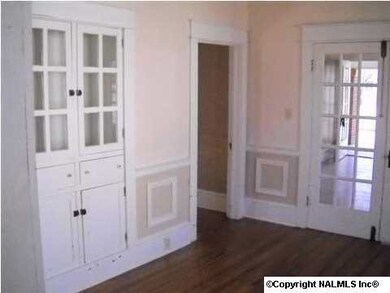 DINING ROOM - SHOWING BUILT IN CABINET