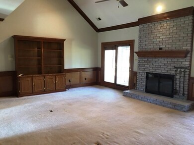 Great room with huge bookcase and fireplace!