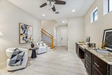 Rare for Cottage Grove, this home features a true bonus living area on the first floor, complete with custom built-ins, offering flexible use as an office, media room, or lounge.