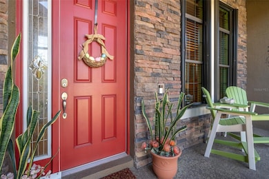 INVITING ENTRANCE WITH BRICK ACCENTS
