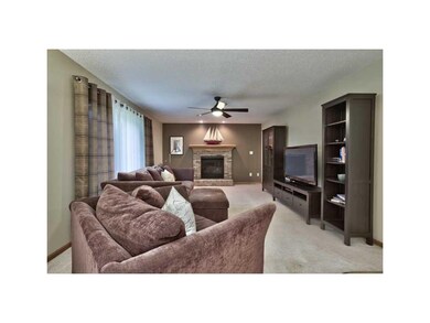 Living Room. GAS FIREPLACE WITH BRICK SURROUND. PL